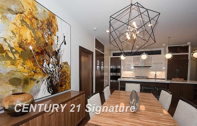 dining space with a notable chandelier and recessed lighting