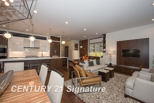 living room featuring recessed lighting and light wood-style flooring