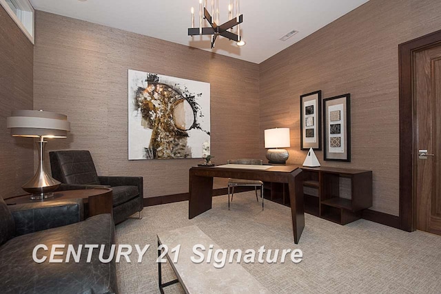 home office with carpet, visible vents, and an inviting chandelier