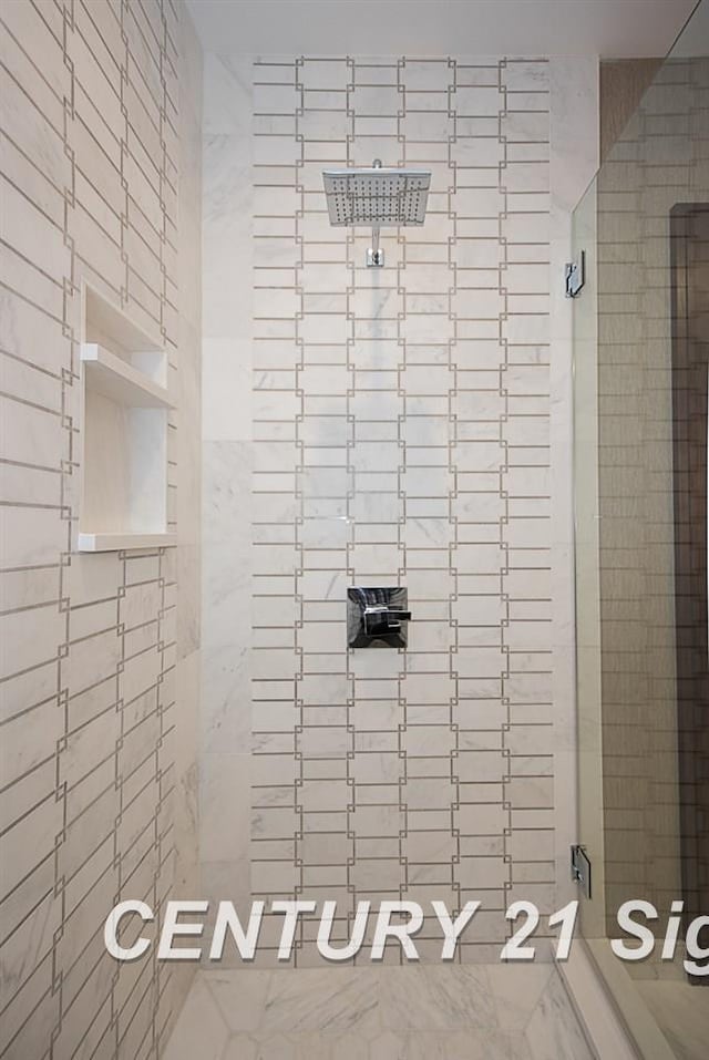 bathroom featuring a shower stall