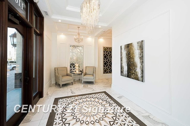 110 E Main St, Midland, MI 48640 - hallway with a chandelier, light marble finish floors, ornamental molding, and baseboards