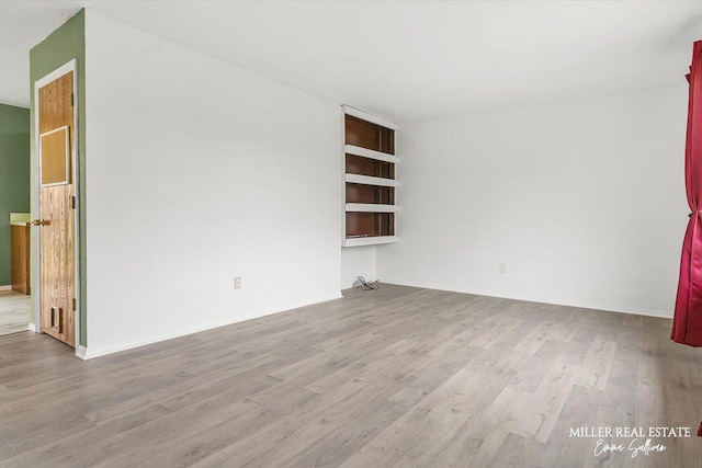 empty room featuring wood finished floors