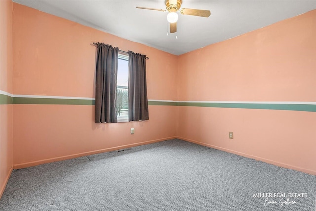 empty room featuring carpet floors, baseboards, and a ceiling fan