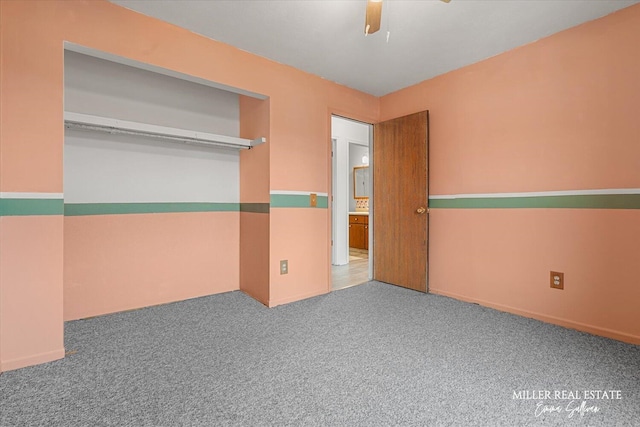 empty room with ceiling fan and carpet flooring