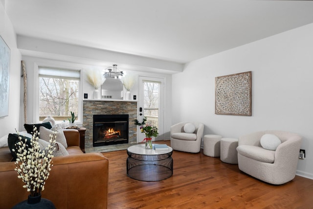 living room featuring a fireplace and wood finished floors