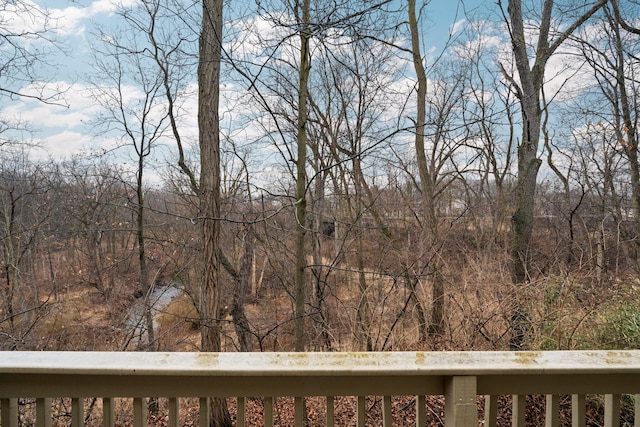 exterior space with a wooded view