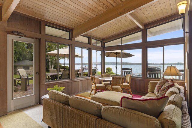 6863 Crystal Dr, Beulah, MI 49617 - sunroom with a water view, wooden ceiling, wood walls, and carpet