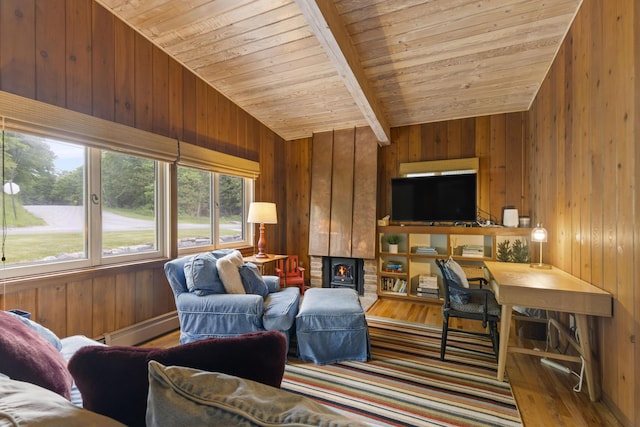 6863 Crystal Dr, Beulah, MI 49617 - living room with a wood ceiling with exposed beams, wooden walls, a baseboard heating unit, wood finished floors, and a fireplace
