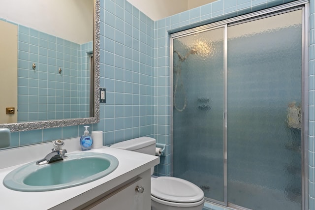 6863 Crystal Dr, Beulah, MI 49617 - full bathroom featuring a stall shower, vanity, and tile walls