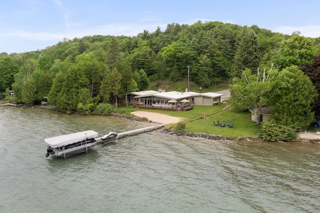 6863 Crystal Dr, Beulah, MI 49617 - view of subject property featuring a nearby body of water and a heavily wooded area