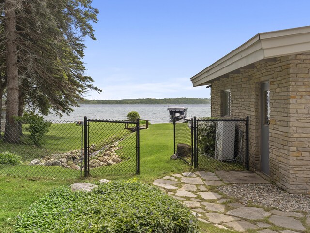 6863 Crystal Dr, Beulah, MI 49617 - view of yard featuring a gate and a water view