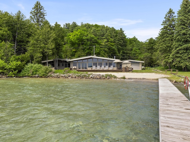 6863 Crystal Dr, Beulah, MI 49617 - dock area with a water view and a forest view