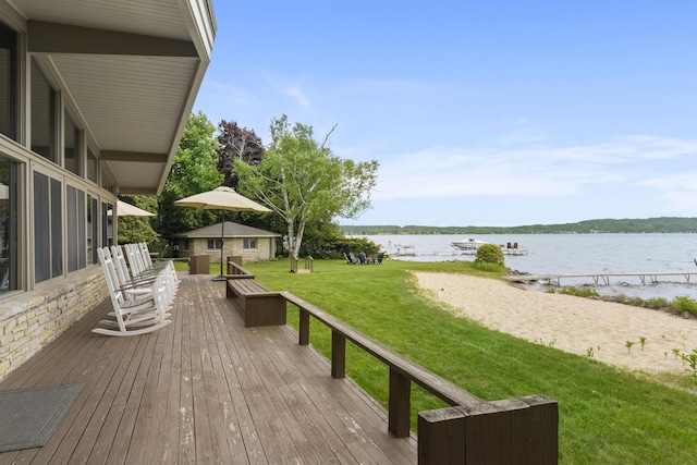 6863 Crystal Dr, Beulah, MI 49617 - wooden terrace with a water view and a yard