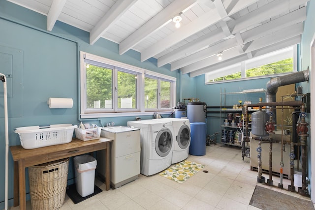 6863 Crystal Dr, Beulah, MI 49617 - laundry room featuring washing machine and clothes dryer, wood ceiling, and healthy amount of natural light