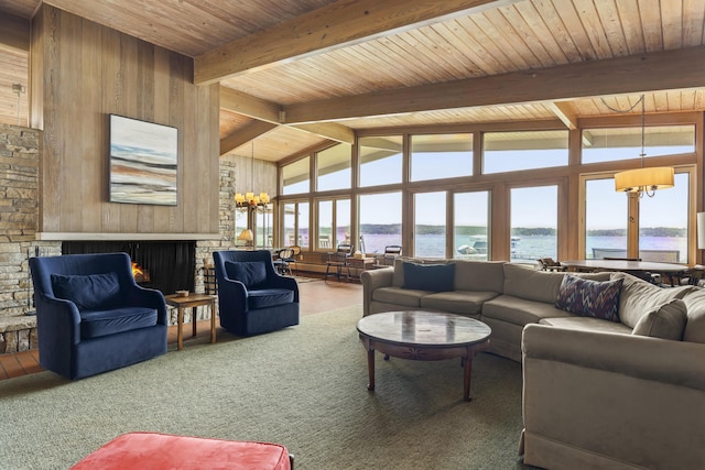 6863 Crystal Dr, Beulah, MI 49617 - carpeted living room featuring a chandelier, plenty of natural light, a water view, and wooden ceiling