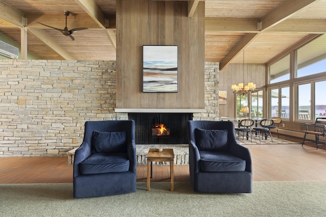 6863 Crystal Dr, Beulah, MI 49617 - sitting room with wooden ceiling, a warm lit fireplace, a chandelier, a ceiling fan, and an AC wall unit