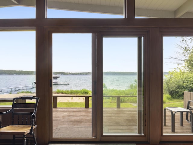 6863 Crystal Dr, Beulah, MI 49617 - doorway to outside featuring a water view and beam ceiling