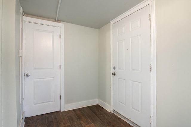 interior space with dark wood-style floors and baseboards