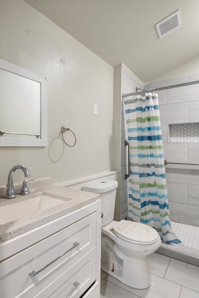 bathroom with visible vents, toilet, vaulted ceiling, vanity, and a shower stall