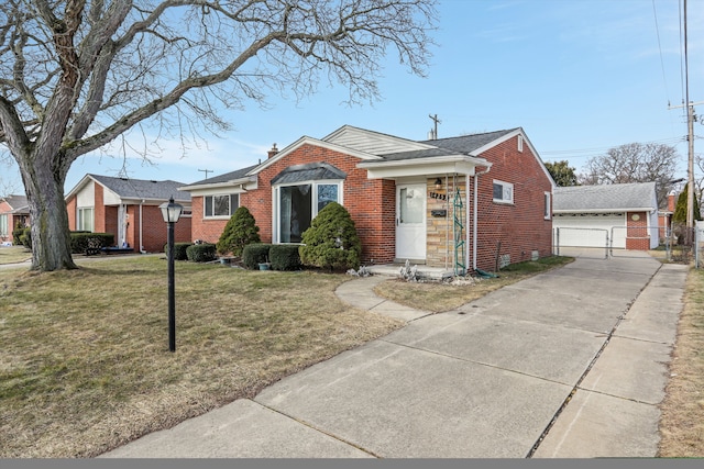 bungalow-style home with an outbuilding, brick siding, a chimney, and a front yard