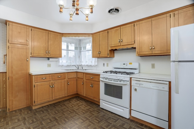 kitchen with light countertops, white appliances, a sink, and visible vents