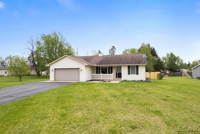 ranch-style house with an attached garage, fence, aphalt driveway, and a front yard