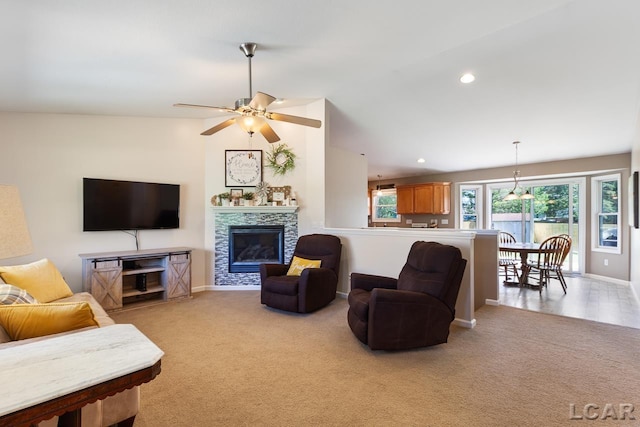 living room with a tile fireplace, light colored carpet, vaulted ceiling, and recessed lighting