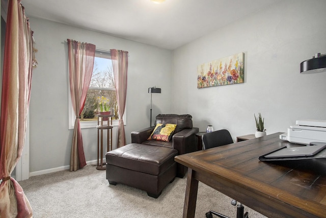 office featuring light carpet and baseboards