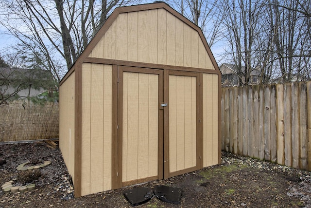 view of shed featuring fence private yard