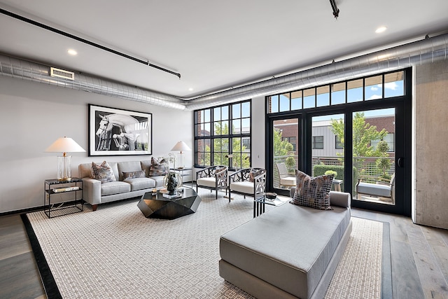 living room featuring visible vents, wood finished floors, and recessed lighting