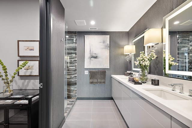 full bath featuring tile patterned flooring, visible vents, a sink, and double vanity