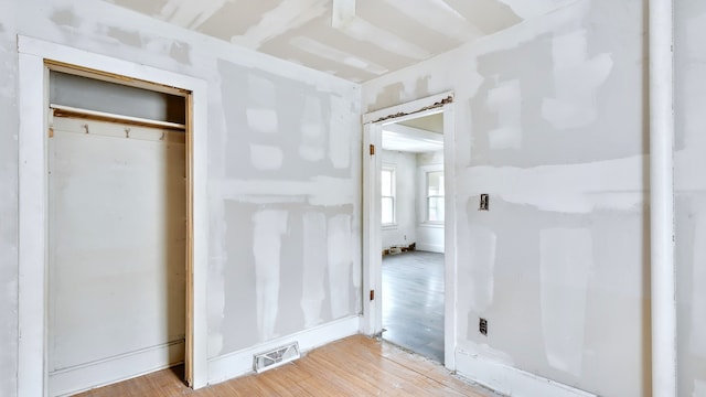 interior space featuring visible vents and wood finished floors