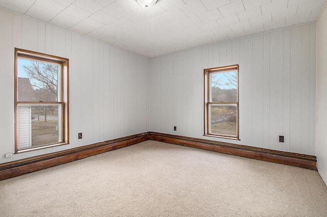 spare room with a baseboard radiator and carpet flooring