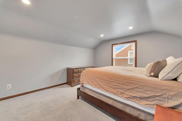 bedroom featuring lofted ceiling, light carpet, baseboards, and recessed lighting