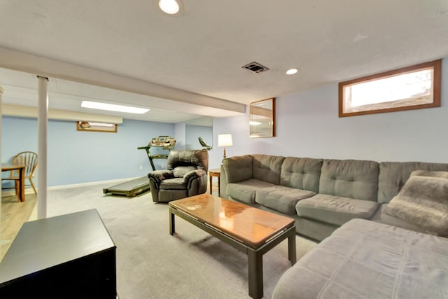 carpeted living room with recessed lighting, visible vents, and baseboards