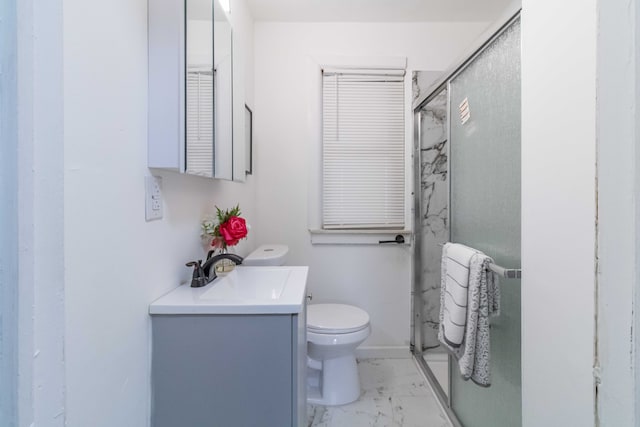 full bathroom featuring marble finish floor, toilet, vanity, and a shower stall