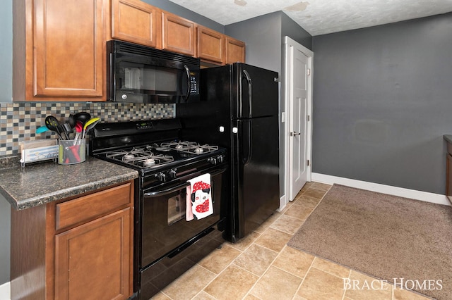 kitchen featuring black appliances, brown cabinetry, dark countertops, and decorative backsplash