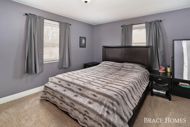 bedroom featuring carpet and baseboards