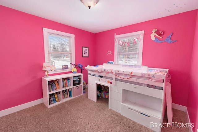 carpeted bedroom with baseboards