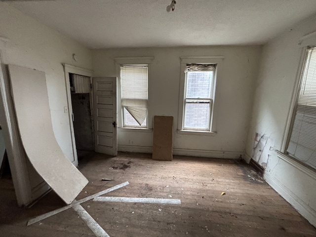 interior space featuring baseboards