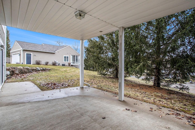 view of patio featuring a garage