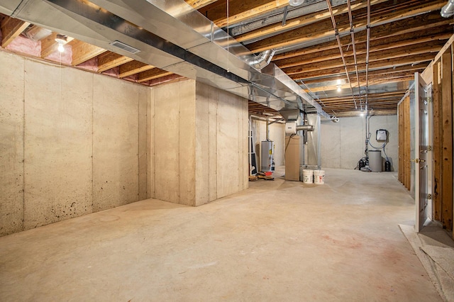 unfinished basement with water heater