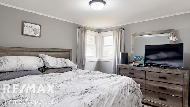 bedroom featuring crown molding