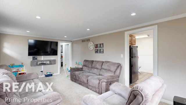 living area with carpet floors, recessed lighting, visible vents, and crown molding