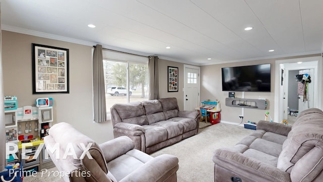 carpeted living room featuring ornamental molding, recessed lighting, and baseboards