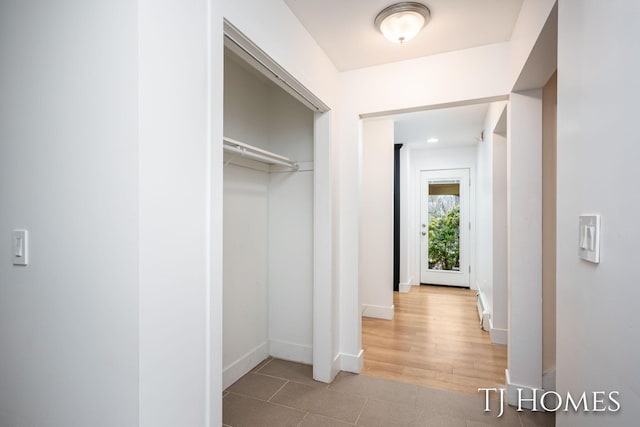 closet featuring a baseboard heating unit