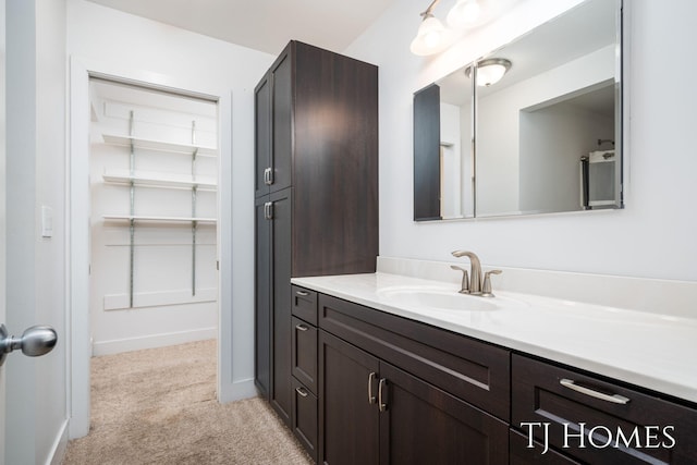 bathroom with baseboards and vanity