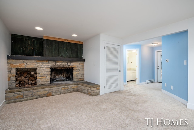 unfurnished living room featuring baseboards, carpet flooring, a fireplace, a baseboard heating unit, and recessed lighting