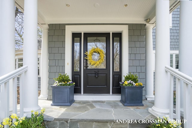 6059 Lakeshore Dr, West Olive, MI 49460 - view of exterior entry with a porch