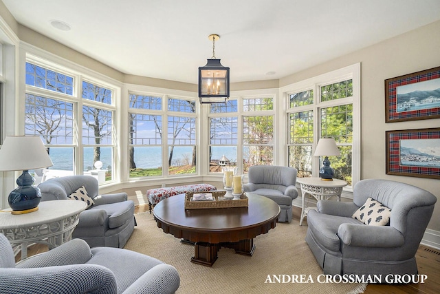 6059 Lakeshore Dr, West Olive, MI 49460 - sunroom featuring a notable chandelier